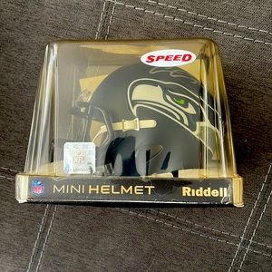 Mini Seahawks helmet signed by Chris Carson with Certificate of Authenticity.